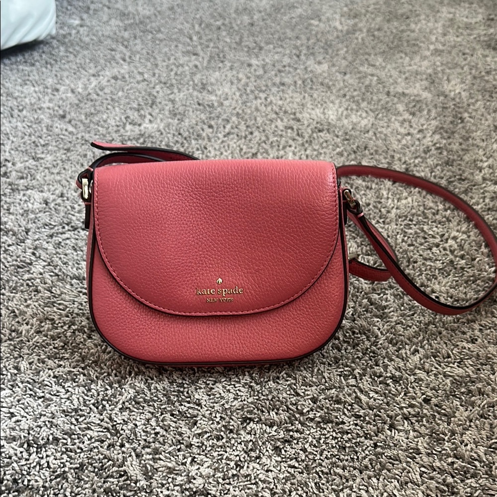 Kate Spade Pink Crossbody Bag with Curved Flap and Adjustable Strap